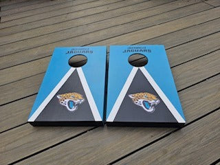 Front view of teal and black Jacksonville-themed wooden cornhole boards