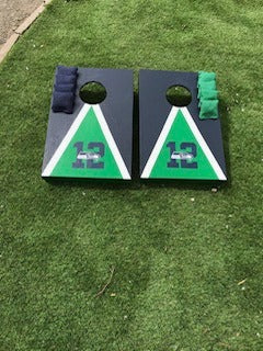 Front view of blue and green Seattle-themed wooden cornhole boards